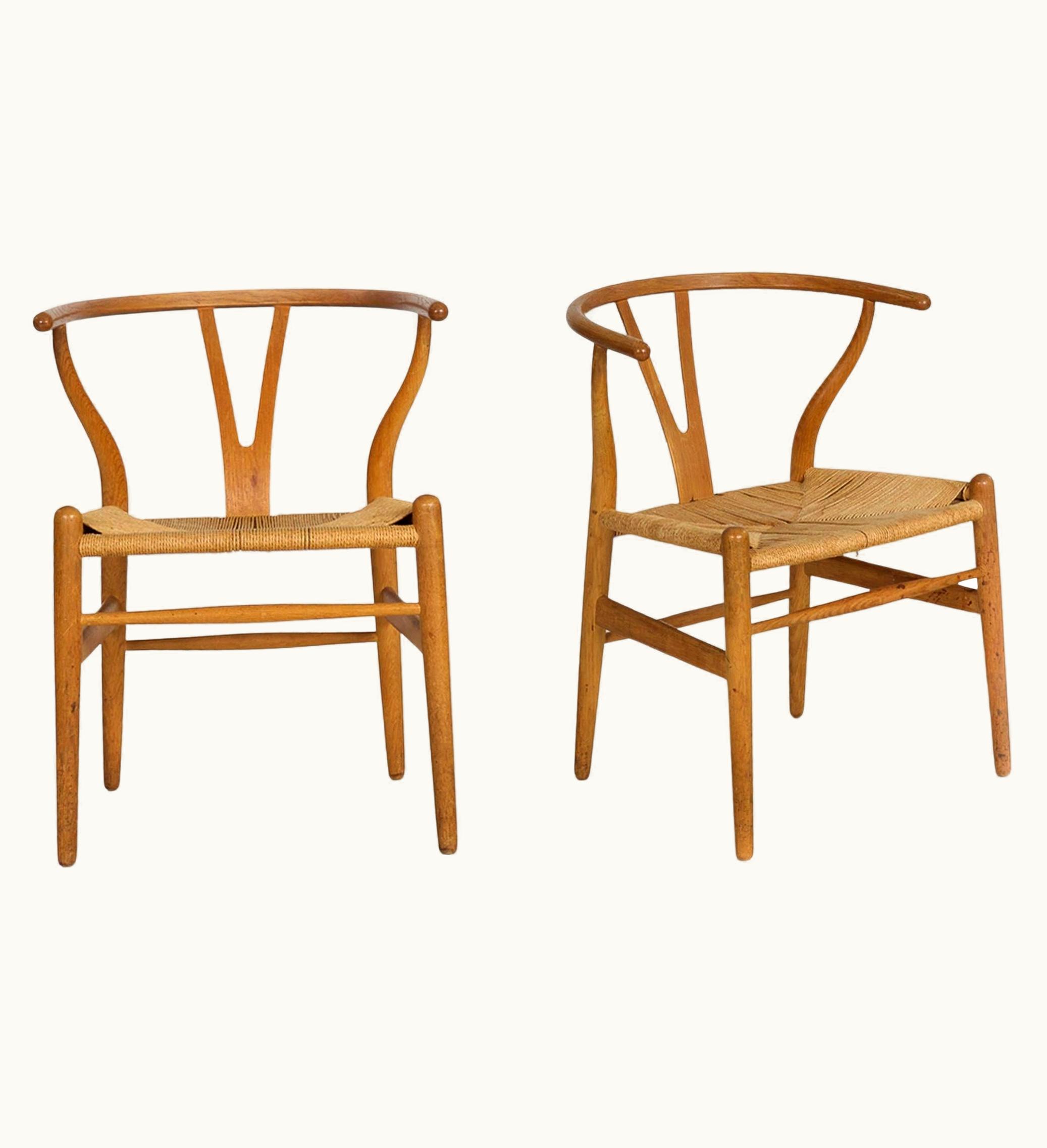 Hans J. Wegner Hans J. Wegner Pair Of Patinated Oak "Wishbone" Arm Chairs By Hans Wegner Circa 1960s