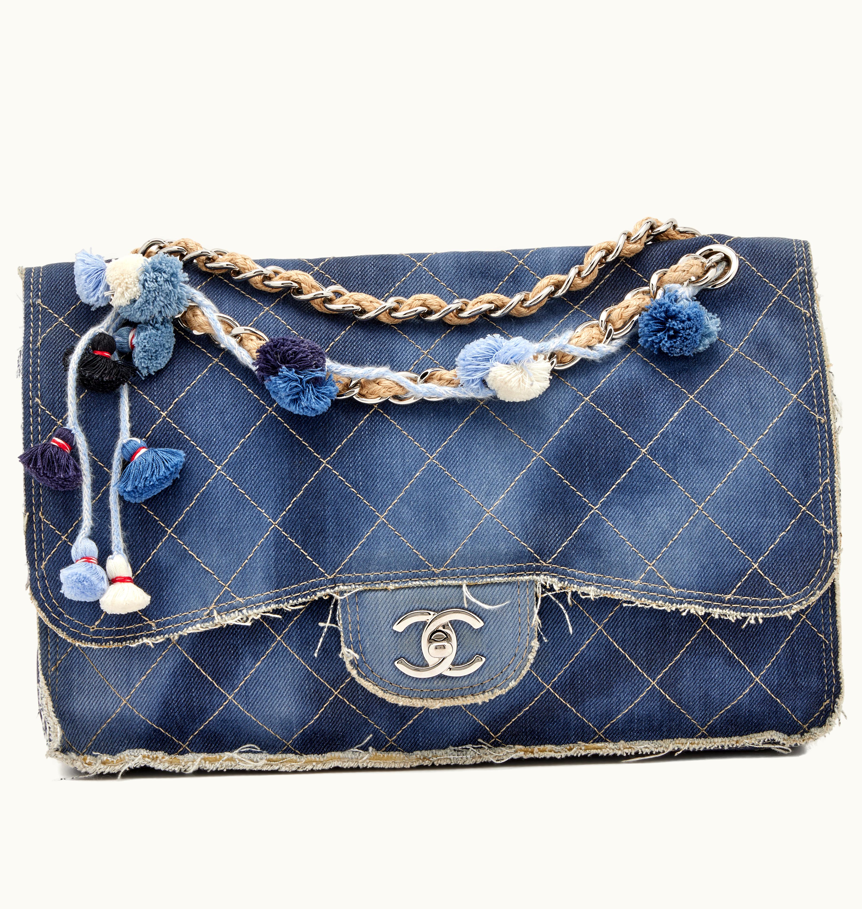 Chanel Chanel Paris-Dubai Pom-Pom Jumbo Flap Bag with Silver Hardware, made with dark blue quilted denim fabric, released in 2015