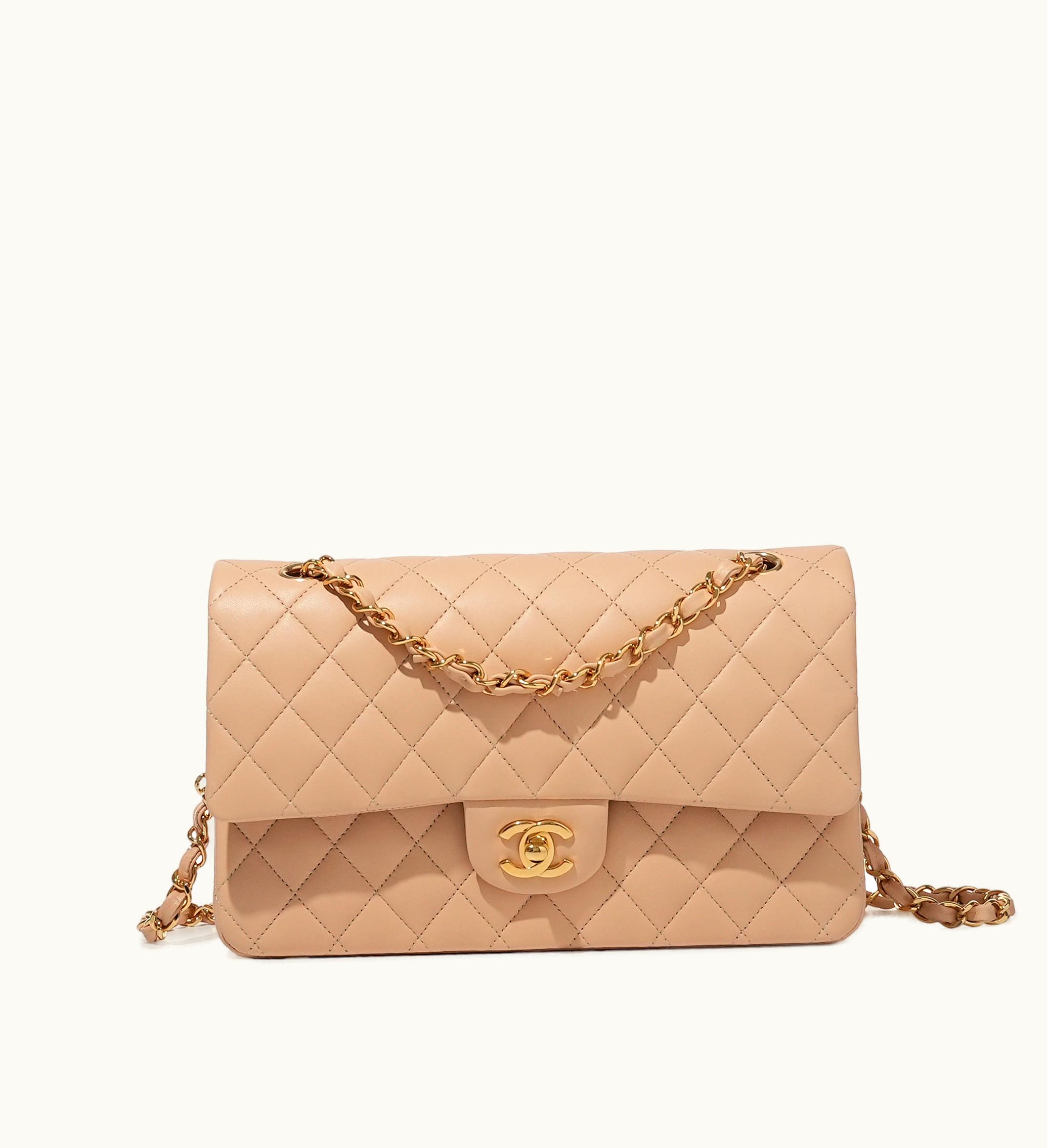 Chanel Chanel Medium Classic Double Flap Bag with Gold Hardware, crafted in quilted lambskin and adorned in a beautiful beige shade