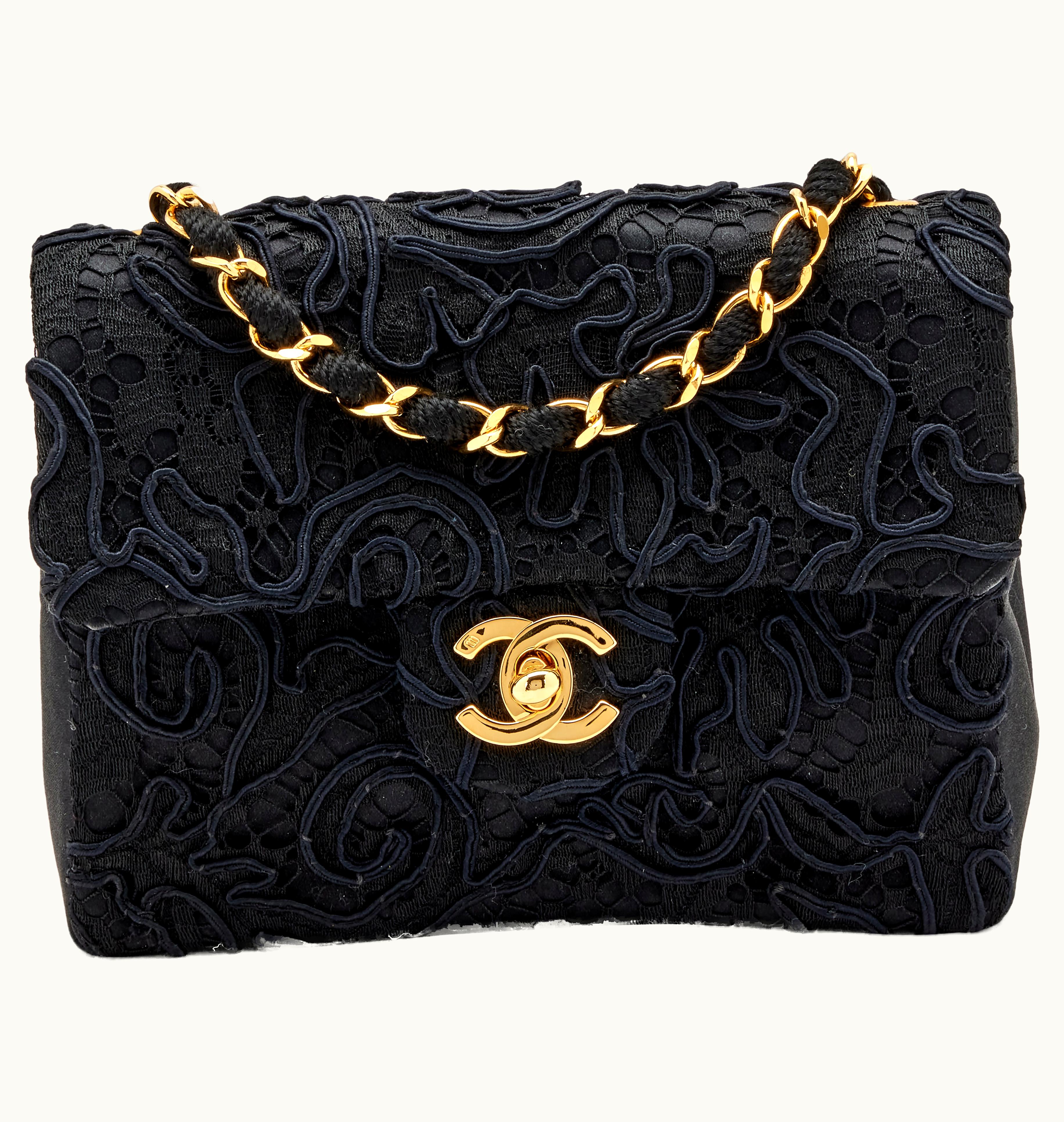 Chanel Chanel Mini Square Classic Single Flap Gold Hardware in 1991, showcasing a captivating blend of black lace and satin
