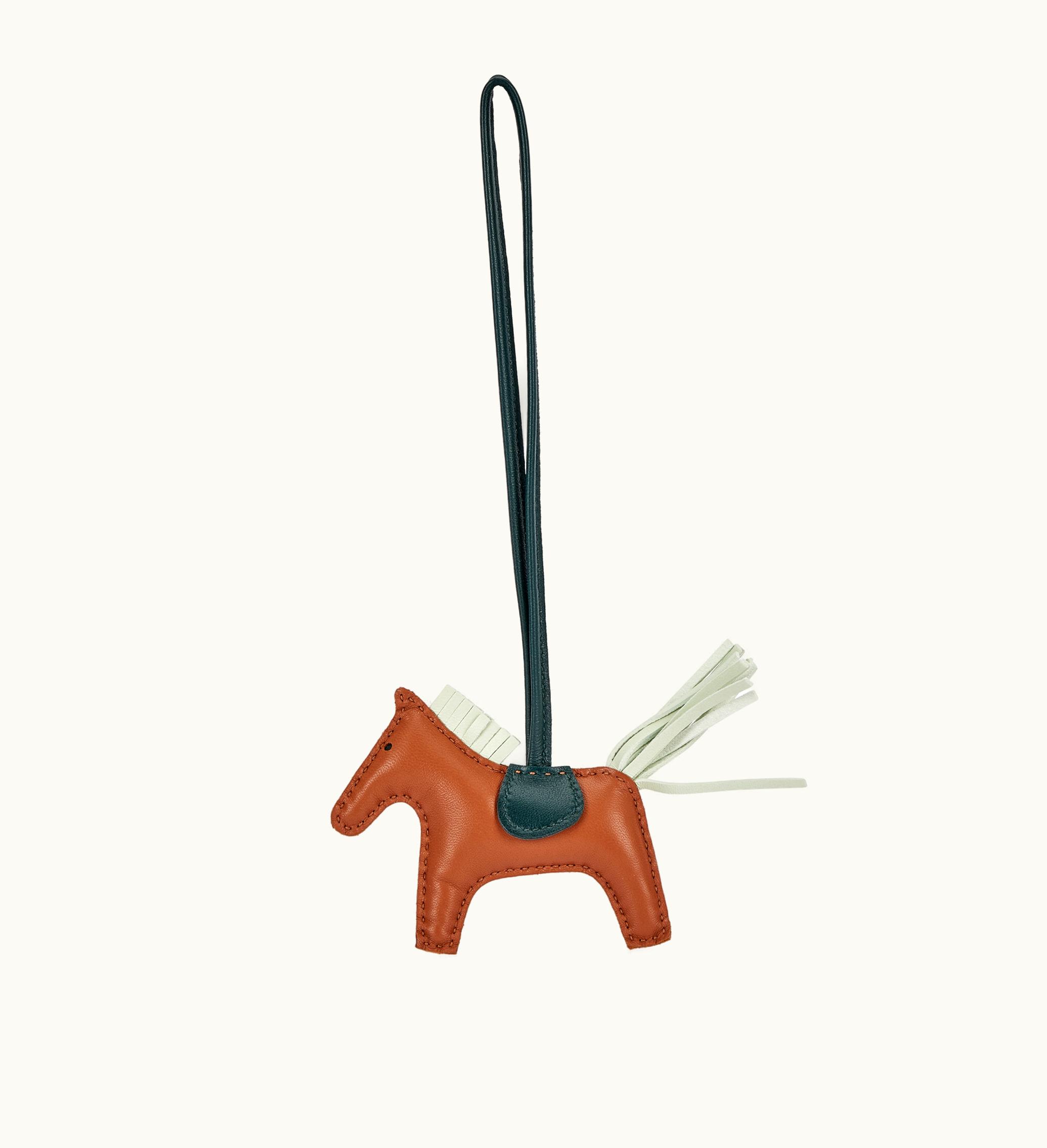 Hermès Hermès 2022 brings the enchanting Hermès Gold, Vert Cypres and Vert Fizz Milo Lambskin and Swift GriGri Rodeo Charm PM