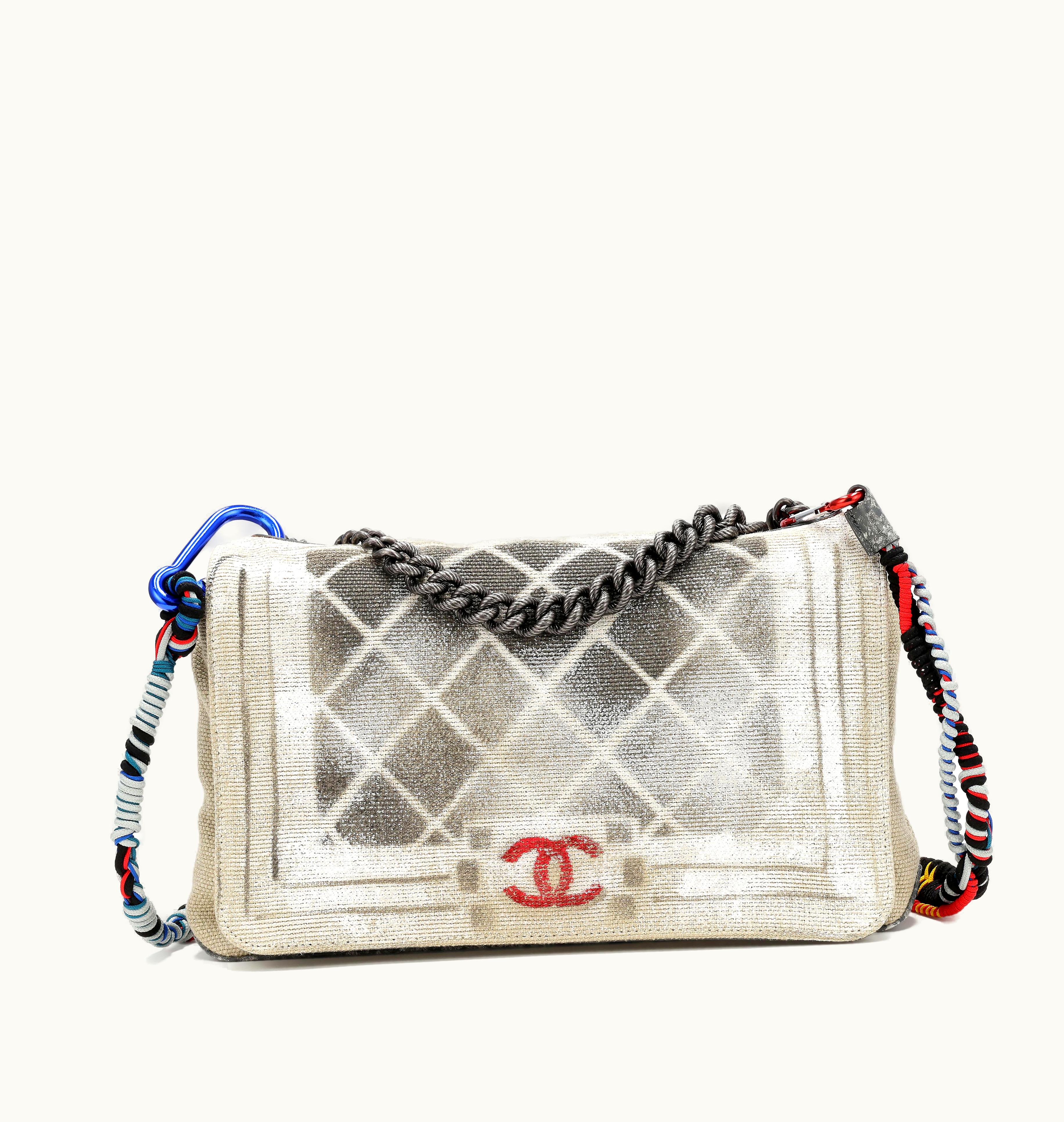 Chanel Chanel 2014 Silver Hardware OH My Boy Bag features a trompe-l'oeil canvas graffiti art design in beige and black