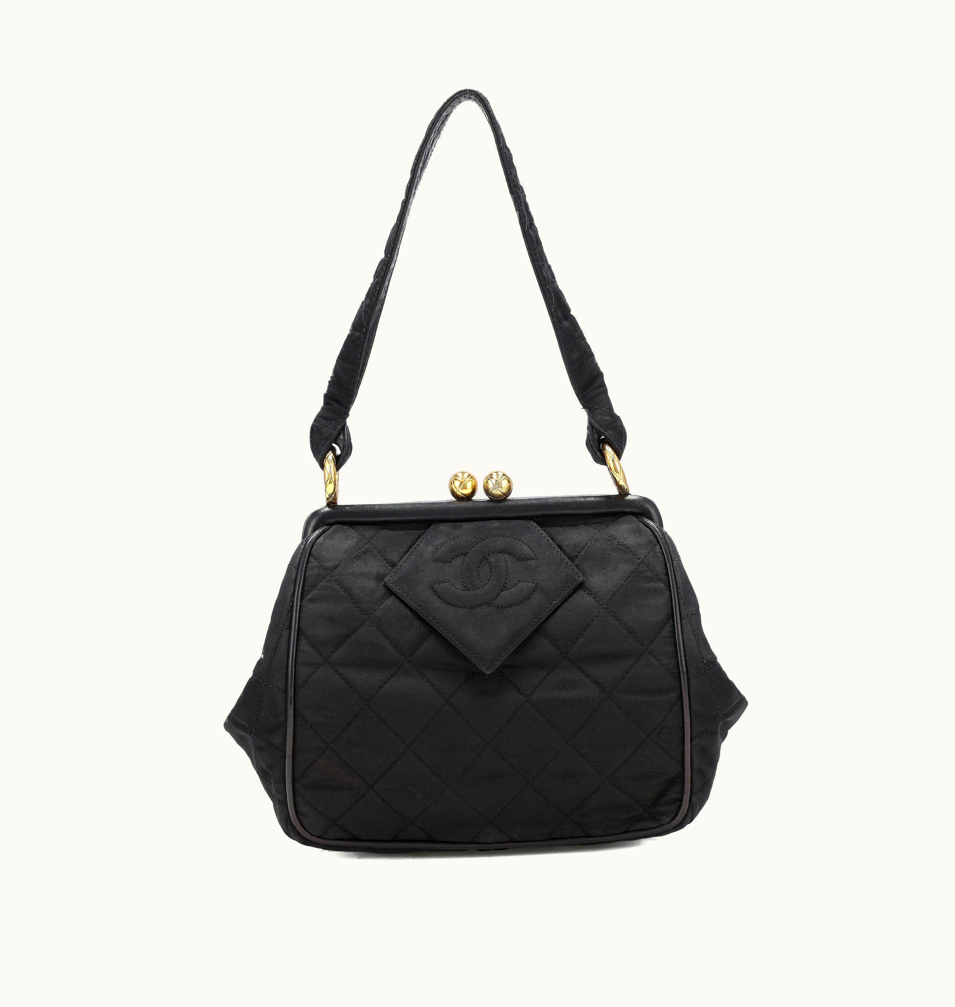 Chanel Chanel Frame Bag crafted from luxurious black nylon with a coveted diamond quilt pattern, originated during the years 1989 to 1991