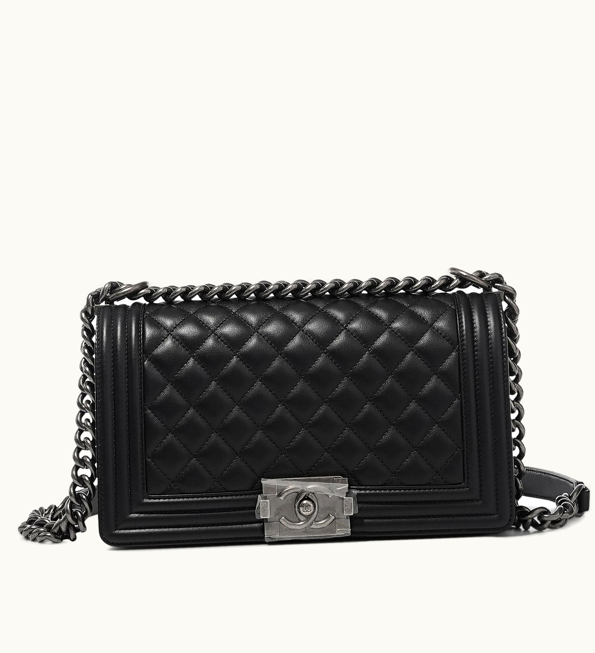 Chanel Chanel Medium Boy Bag with Ruthenium Hardware crafted from Black Quilted Lambskin material with the iconic Chanel touch