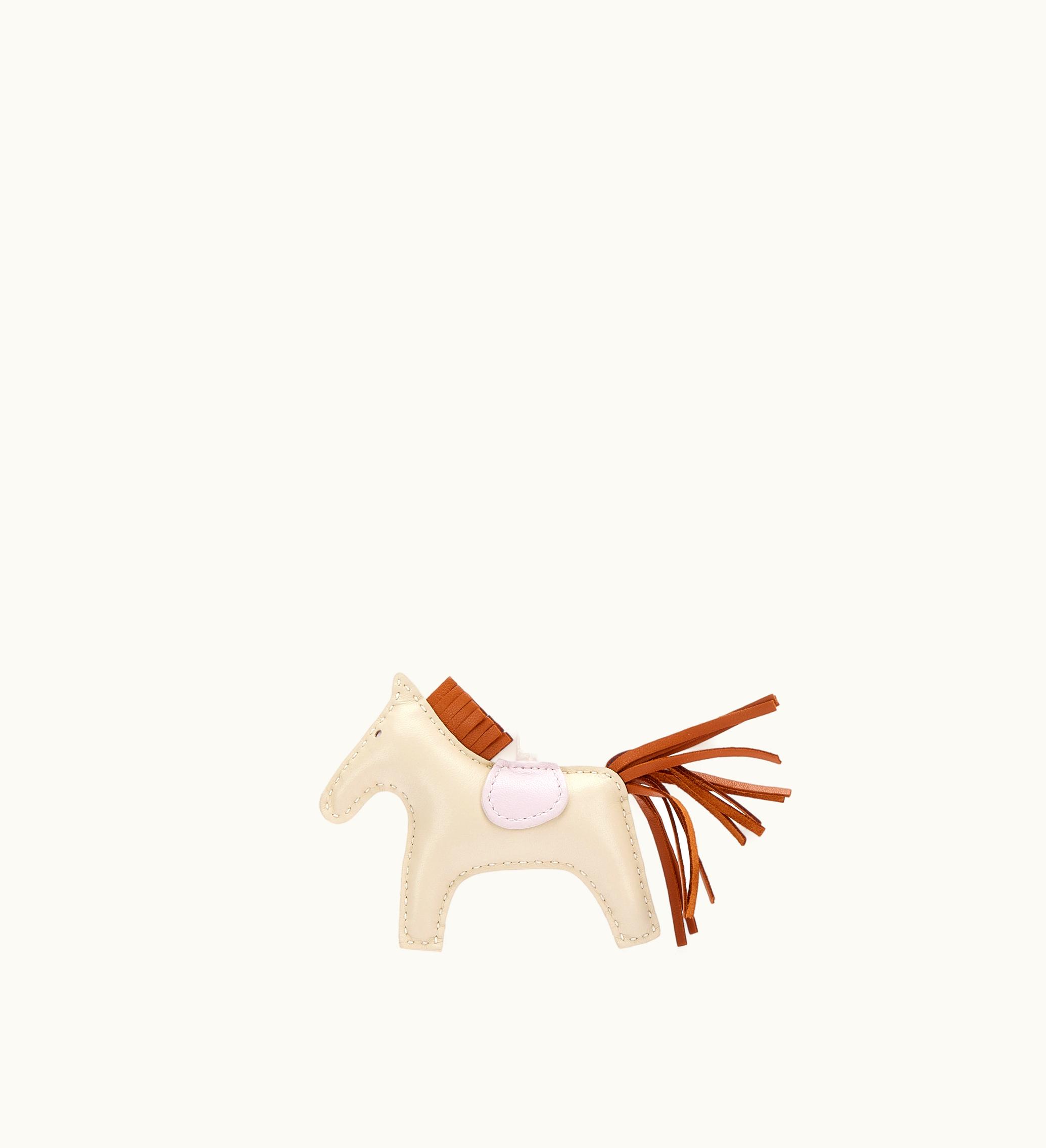 Hermès 2022 introduces the delightful Hermès PM GriGri Rodeo Charm in mesmerizing Craie, Mauve Pale, and Gold Milo alongside Swift Leather