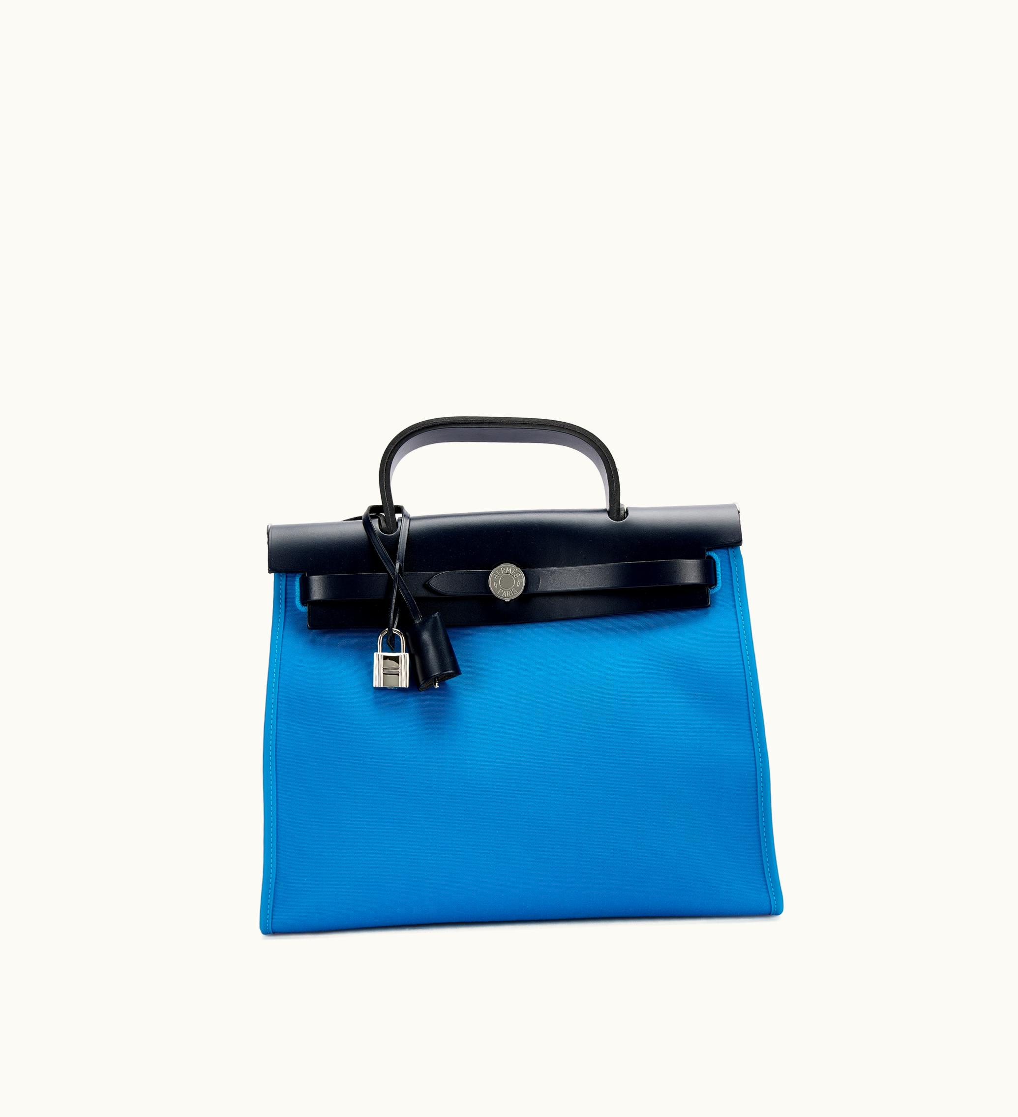Hermès Blue Indigo Cowhide Hunter and Blue Zanzibar Fabric Herbag Zip 31 with Palladium Hardware, released in 2017