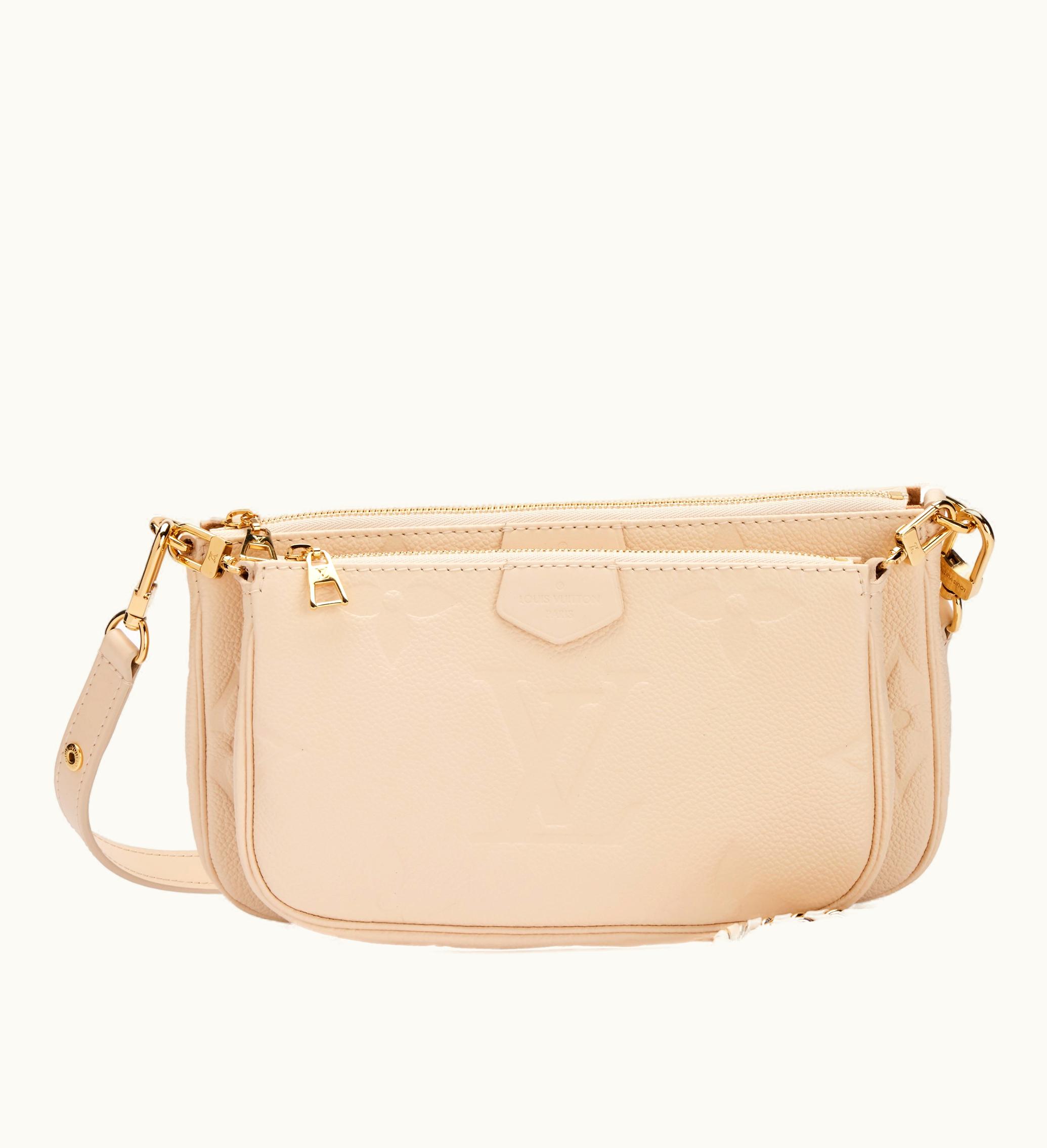Louis Vuitton Louis Vuitton Cream Giant Monogram Empreinte Multi Pochette Accessoires by Louis Vuitton, adorned with Gold Hardware, released in the year 2021