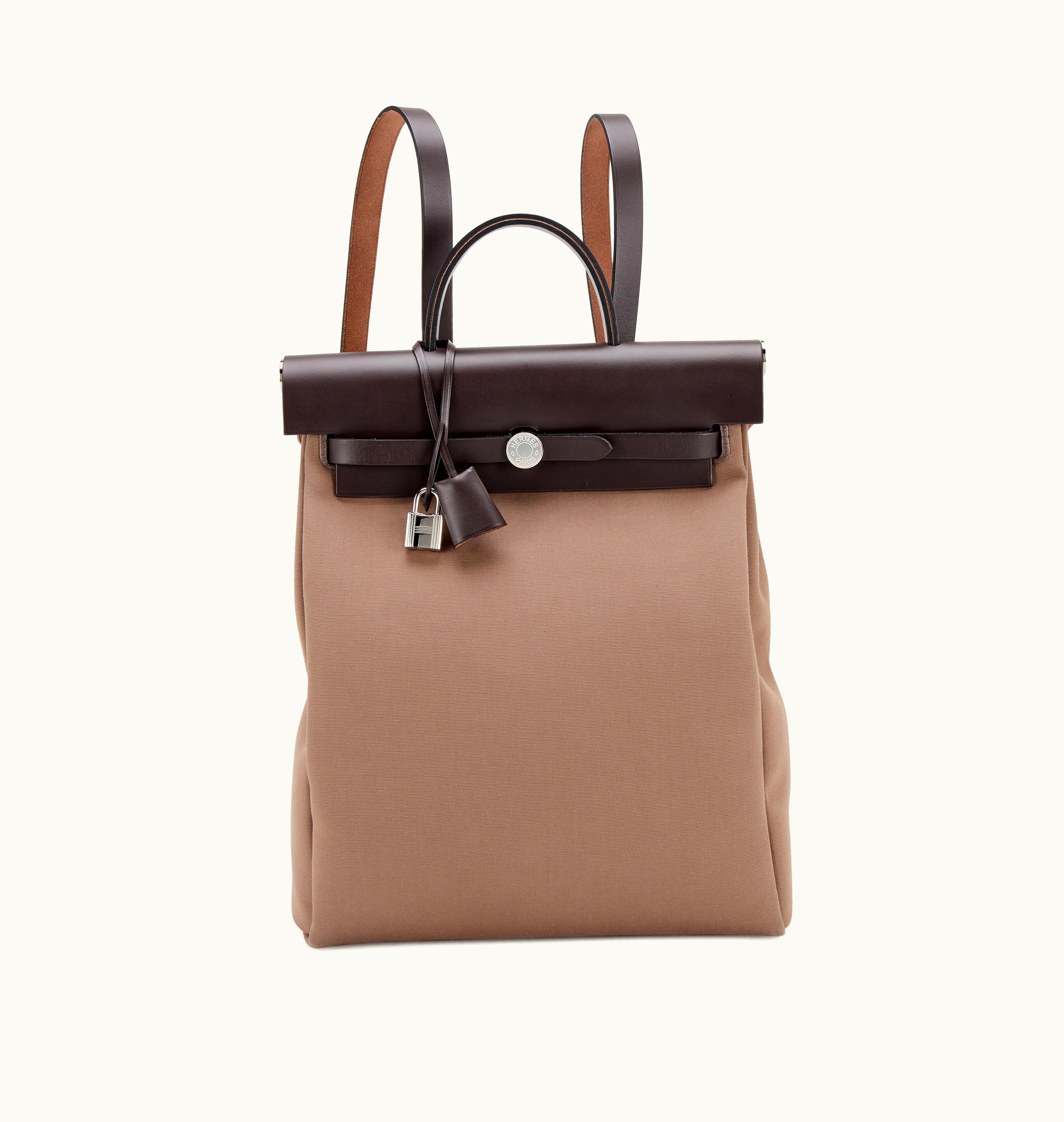 Hermès Hermès 2021 brings an exquisite fusion: Hermès Etoupe Toile Officier and Ebene Vache Hunter Herbag a Dos PM Palladium Hardware