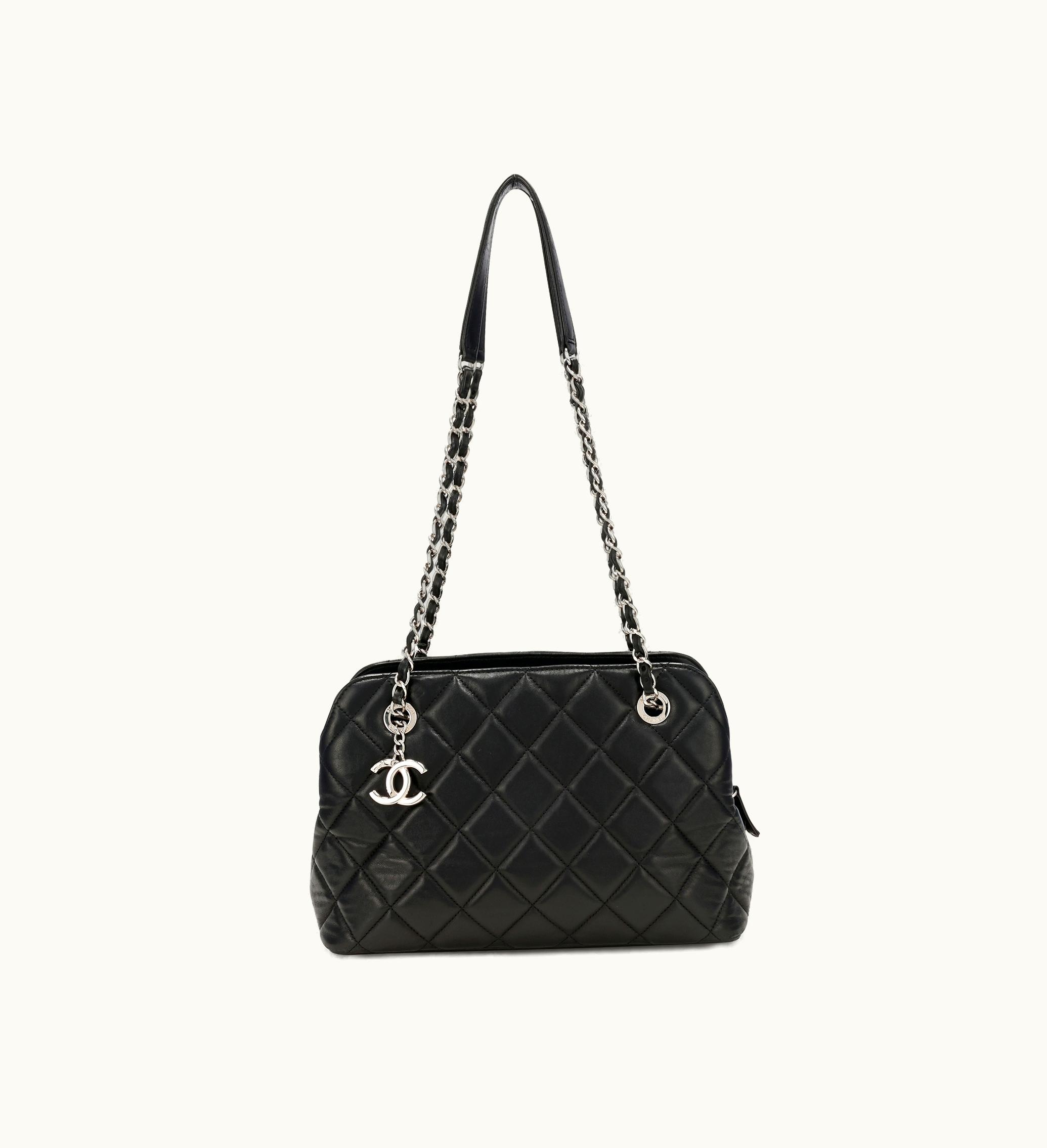 Chanel Chanel 2014 Chanel Bowling Bag in Medium Size, made with Black Quilted Lambskin and adorned with Silver Hardware, featuring the iconic Mademoiselle design