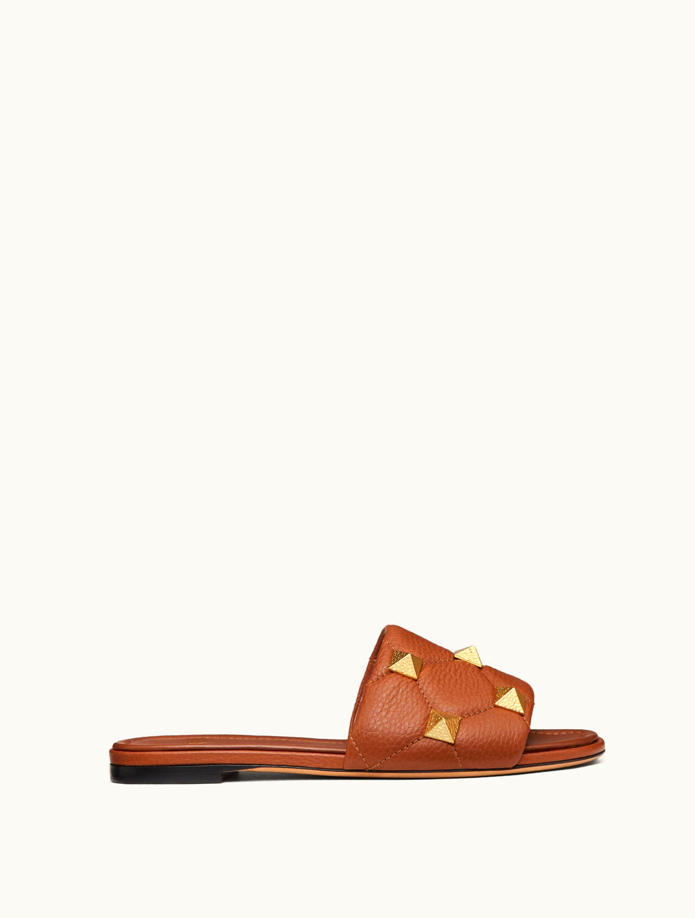 Valentino Valentino Flat Roman Stud Slide Sandal In Quilted Grainy Calfskin For Woman In Saddle Brown