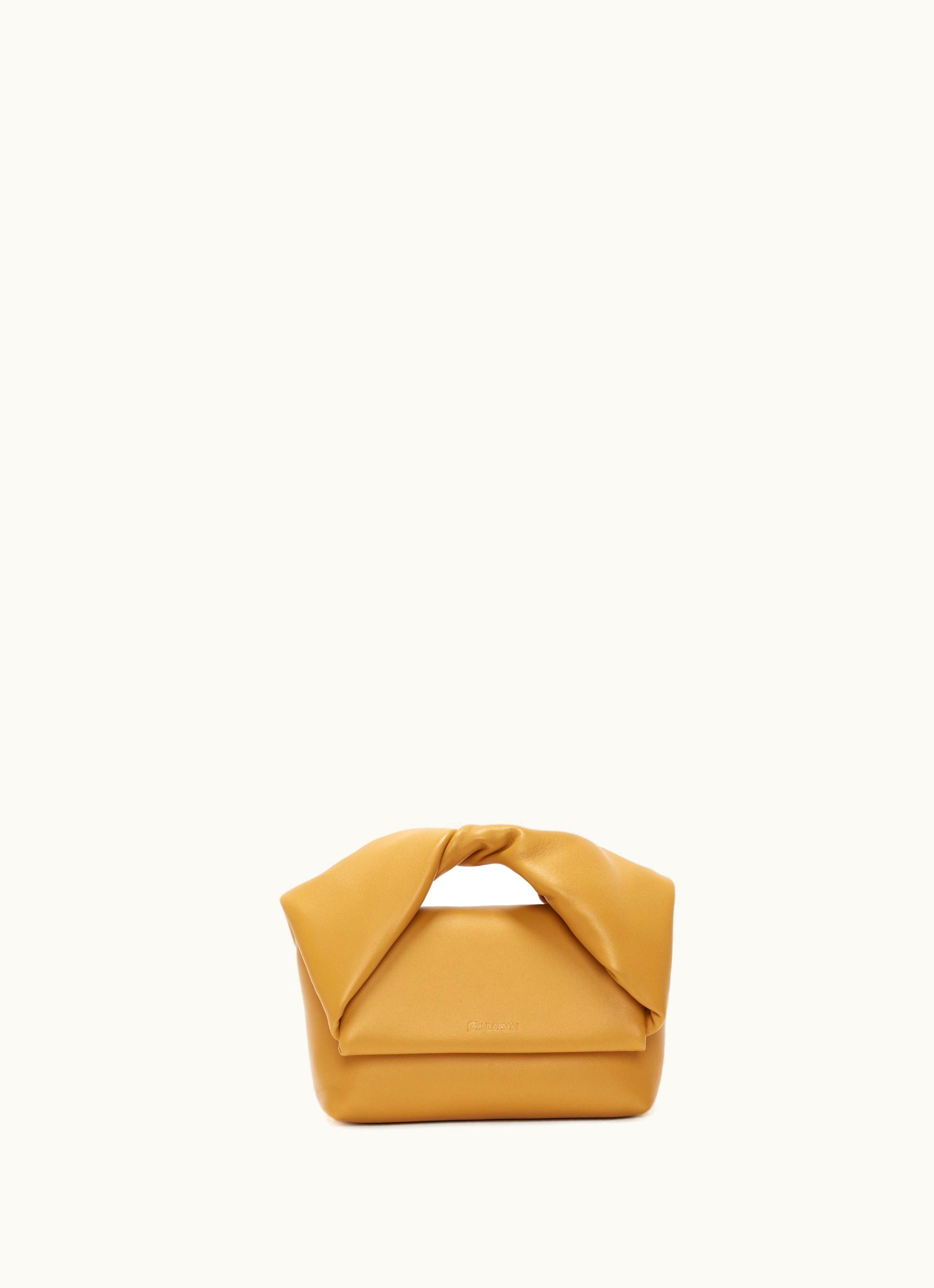 JW Anderson JW Anderson Twisted Elegance Leather Crossbody Bag in Mustard